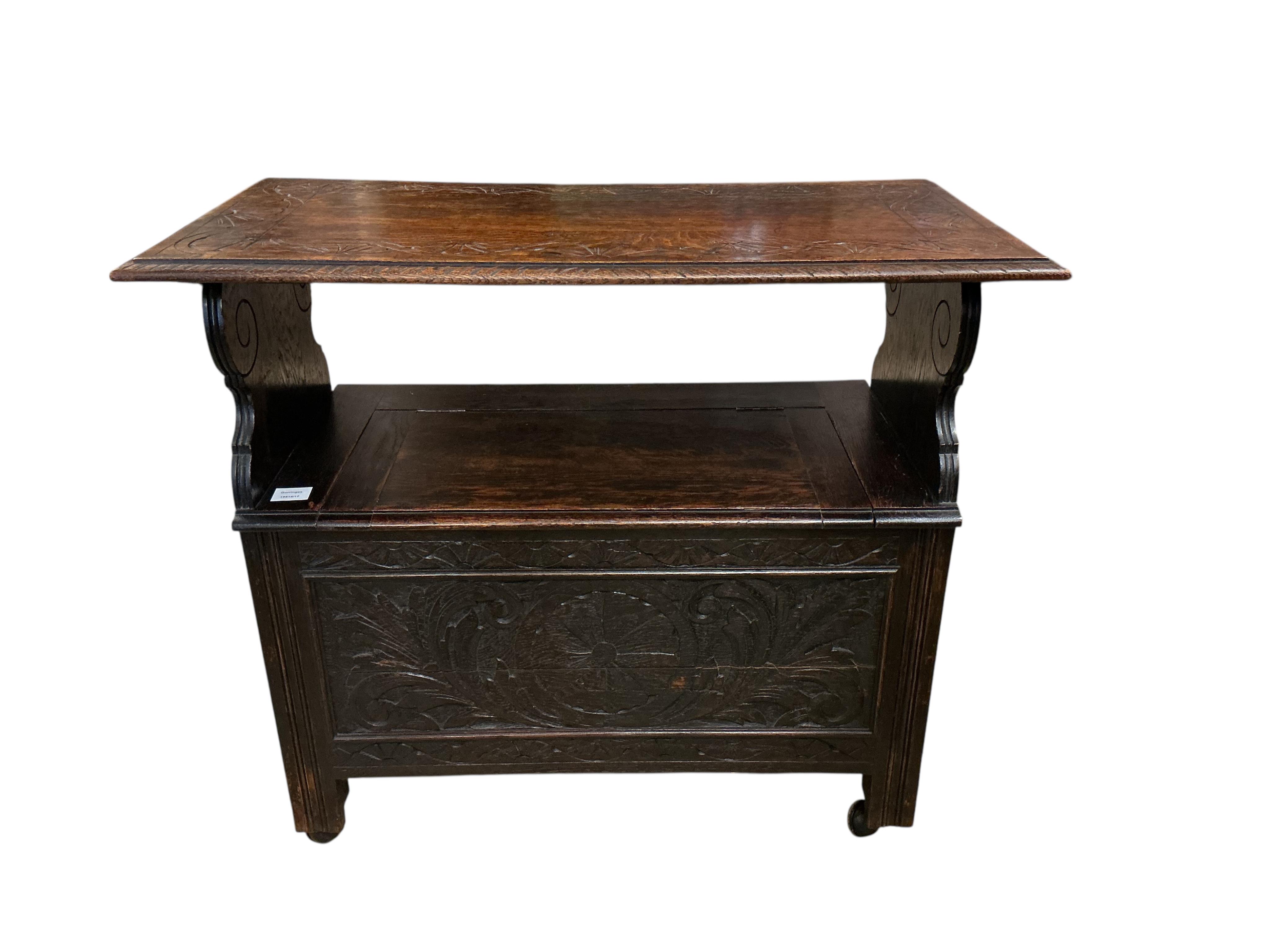 A small 1920's oak monk's bench, width 91cm, depth 46cm, height 106cm